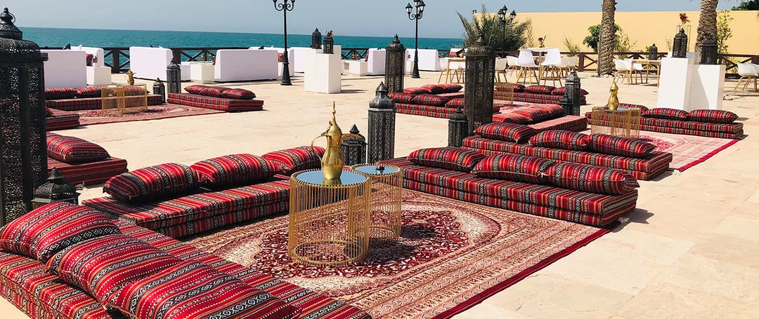 Outdoor hospitality seating creating intimate lounge environments for seasonal hotel dining.