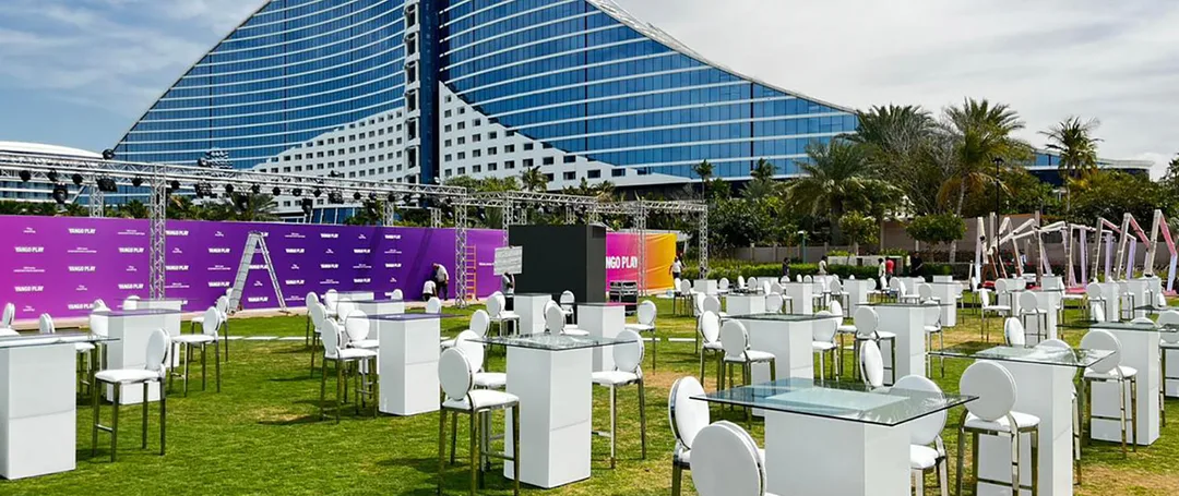 Premium white and silver hospitality furniture supplied by Evolution Furniture for a gala dinner at Jumeirah Beach Hotel.